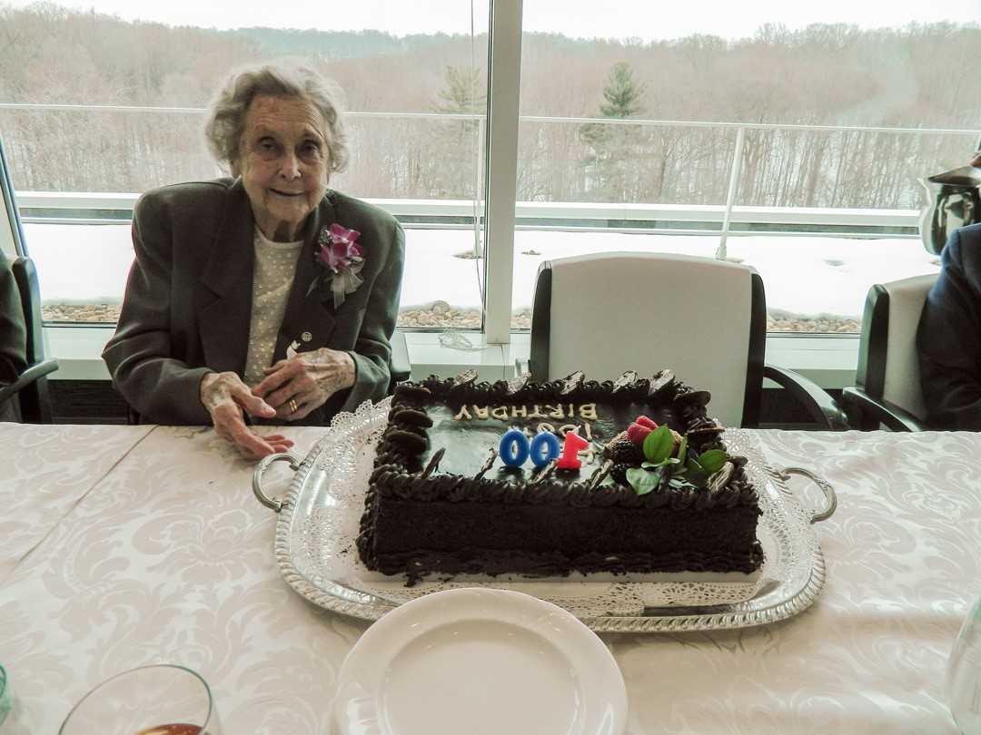 Betty McIntosh at CIA Headquarters sitting at a table in front of her birthday cake.